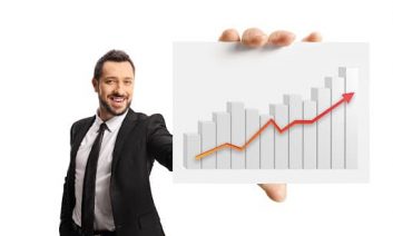 Businessman showing a card with a rising bar chart in front of camera isolated on white background